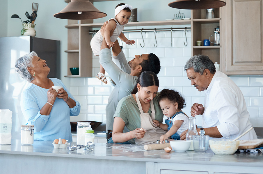 family cooking together in kitchen