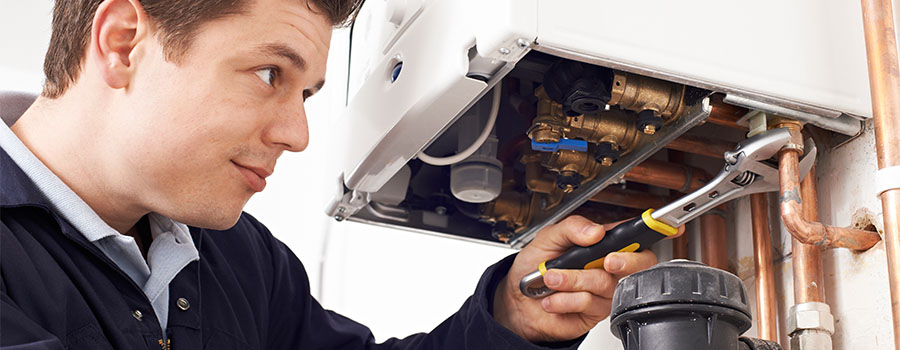 2775-male-technician-working-on-boiler-17235634087472.jpg