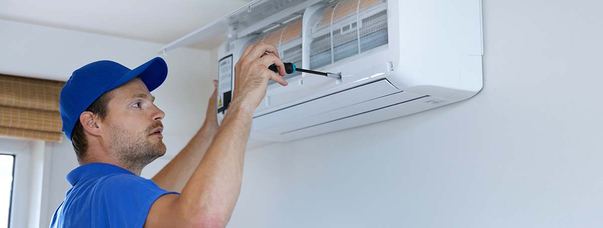 206-hvac-services-technician-installing-air-conditioner-on-the-wall-at-home-16802762709755.jpg